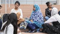 Students gather outdoors on campus